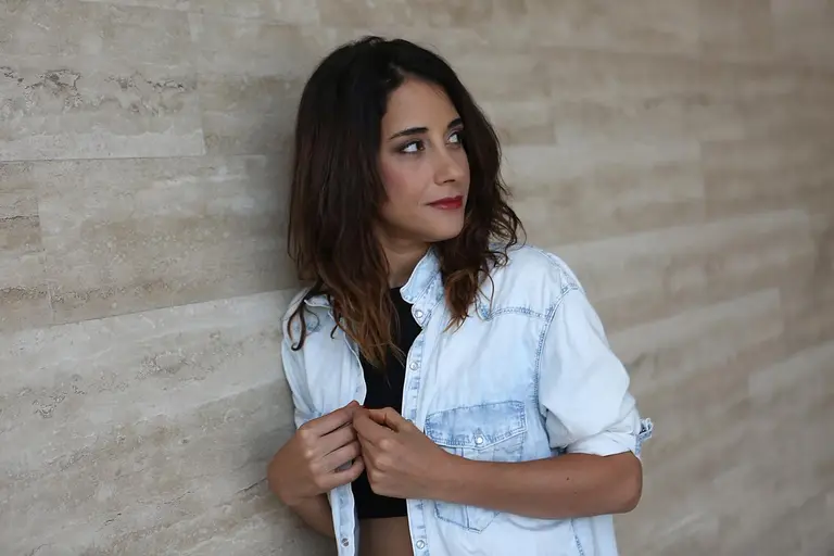 a person leaning against a wall